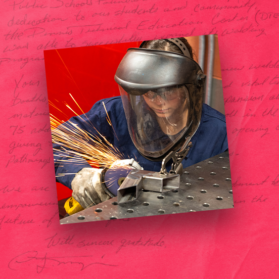 Student in a face shield grinding metal as sparks fly in the welding lab, red textured background surrounds the photo